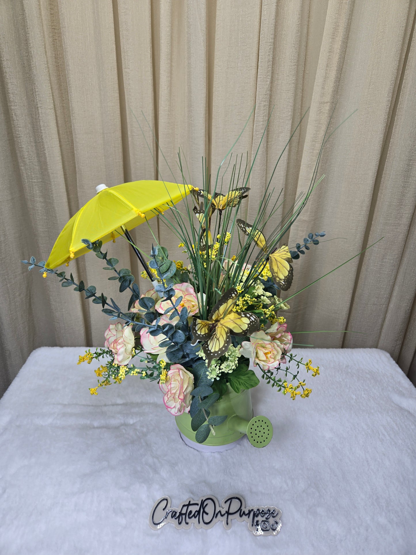 Spring flower arrangement with umbrella